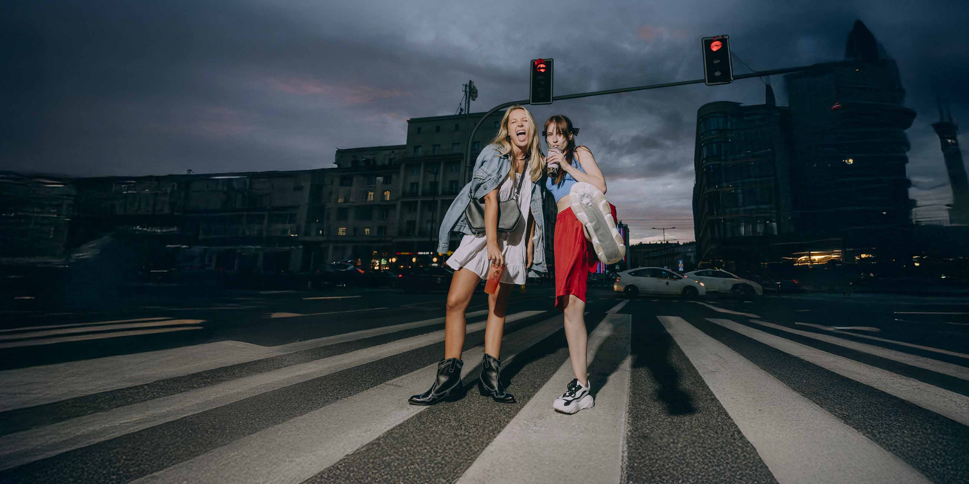 Two happy girls showing shoes